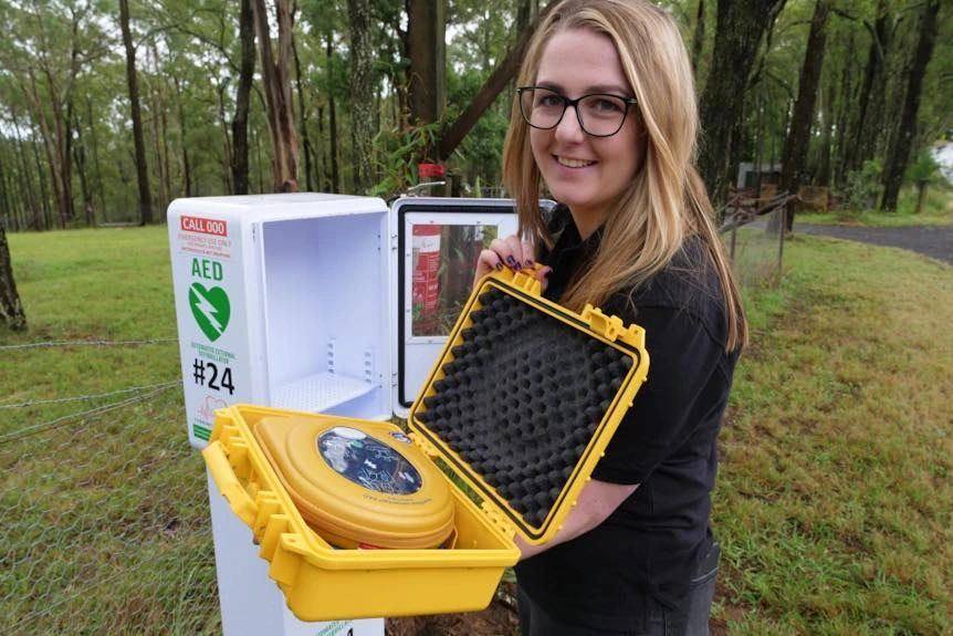 CDP founder Sophie with an installed community AED